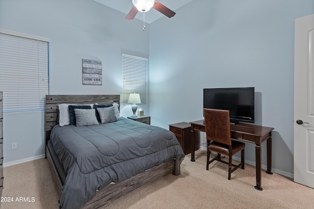 bedroom featuring light carpet and ceiling fan