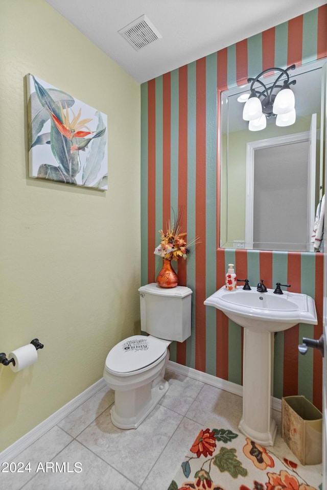 bathroom with tile patterned flooring and toilet