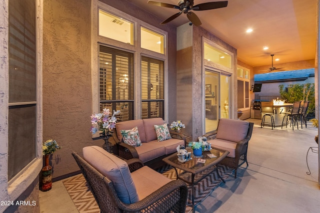 view of patio featuring an outdoor living space, an outdoor bar, and ceiling fan