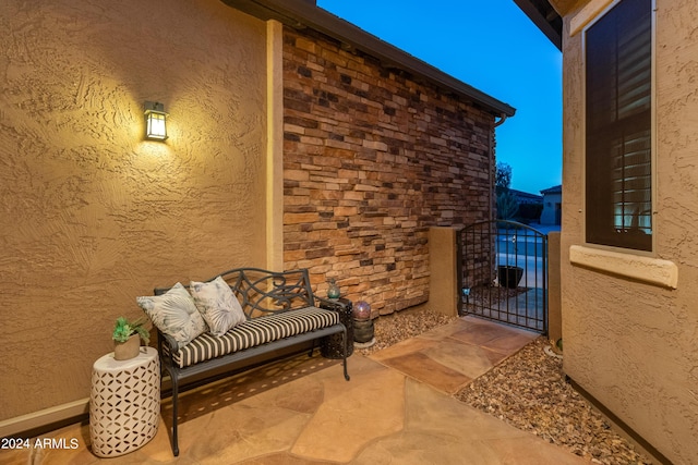 view of patio terrace at dusk