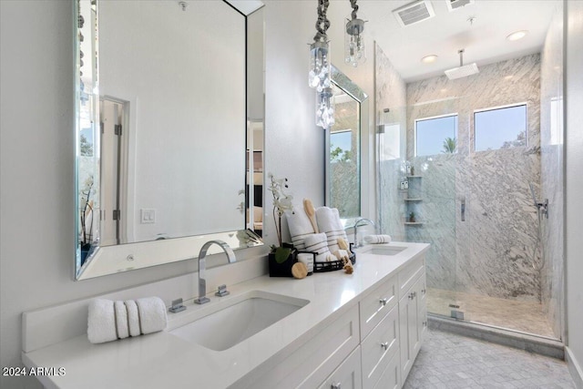 7222 E Gainey Ranch Rd Unit 241, Scottsdale, AZ 85258 - bathroom featuring a marble finish shower, double vanity, and tile patterned flooring
