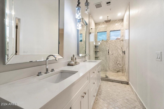 7222 E Gainey Ranch Rd Unit 241, Scottsdale, AZ 85258 - bathroom with a marble finish shower, double vanity, and baseboards