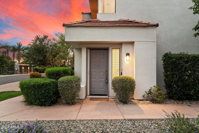 7222 E Gainey Ranch Rd Unit 241, Scottsdale, AZ 85258 - doorway to property with stucco siding