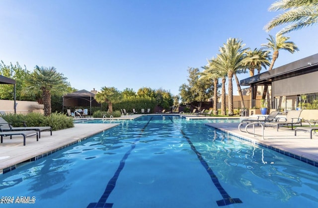 7222 E Gainey Ranch Rd Unit 241, Scottsdale, AZ 85258 - community pool featuring a patio