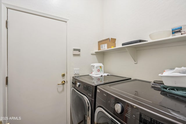 washroom with laundry area and independent washer and dryer