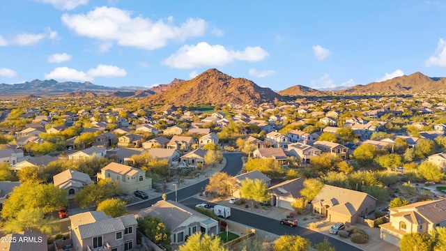 birds eye view of property with a mountain view