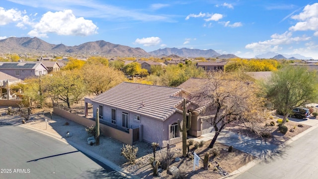 exterior space with a residential view and a mountain view