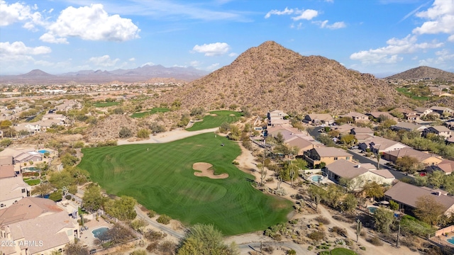 birds eye view of property with view of golf course, a residential view, and a mountain view