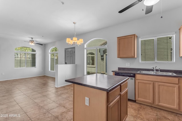 kitchen with a sink, a ceiling fan, dishwasher, and dark countertops