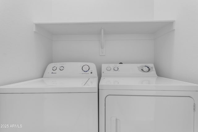laundry room with washer and dryer