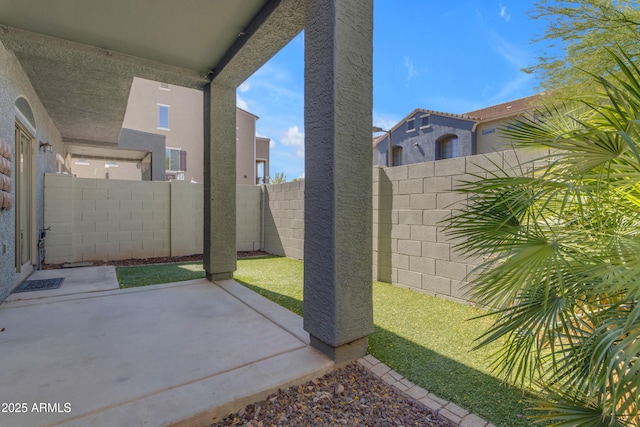 fenced backyard featuring a patio