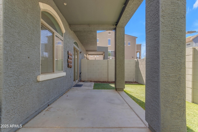 fenced backyard with a patio area