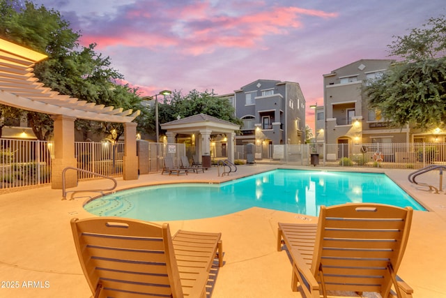 community pool featuring a patio and a gazebo