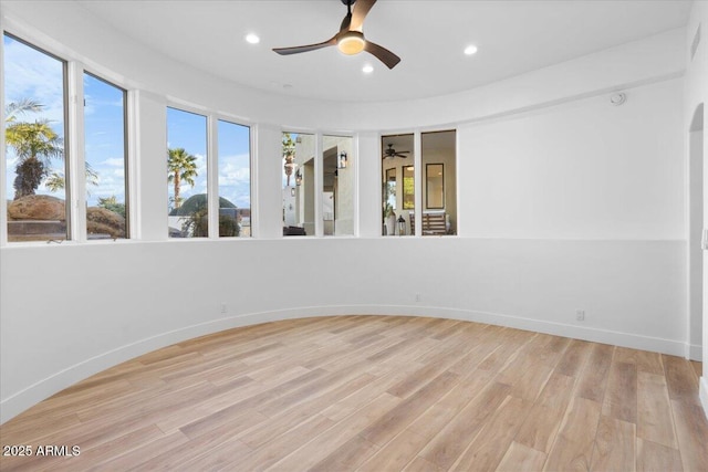 unfurnished room with recessed lighting, light wood-style flooring, and baseboards