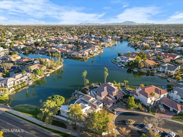 bird's eye view featuring a water view and a residential view