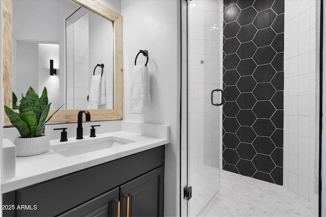 bathroom with a stall shower and vanity