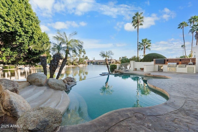 view of pool with a water view, grilling area, and area for grilling