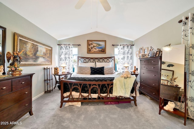 carpeted bedroom with ceiling fan and lofted ceiling