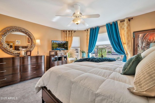 bedroom featuring ceiling fan and light colored carpet