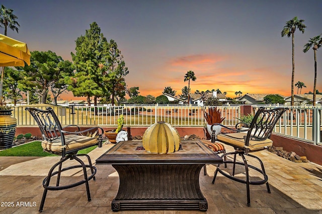 view of patio terrace at dusk