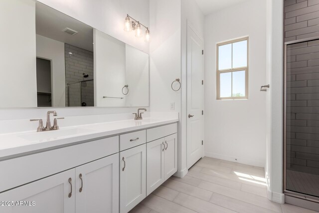 12029 W Marguerite Ave, Avondale, AZ 85323 - full bath with a stall shower, double vanity, and baseboards