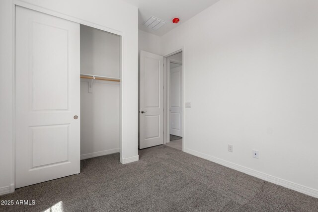 12029 W Marguerite Ave, Avondale, AZ 85323 - unfurnished bedroom with carpet flooring, a closet, and baseboards