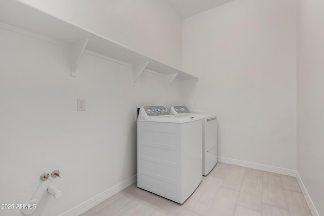 12029 W Marguerite Ave, Avondale, AZ 85323 - laundry area with washer and dryer, baseboards, and light wood-style floors