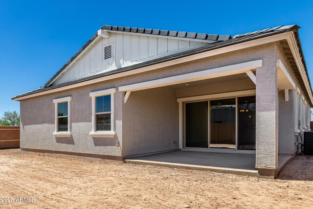 12029 W Marguerite Ave, Avondale, AZ 85323 - rear view of property with board and batten siding, a patio area, and cooling unit