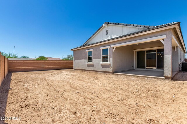 12029 W Marguerite Ave, Avondale, AZ 85323 - rear view of property featuring a patio, a fenced backyard, board and batten siding, and stucco siding