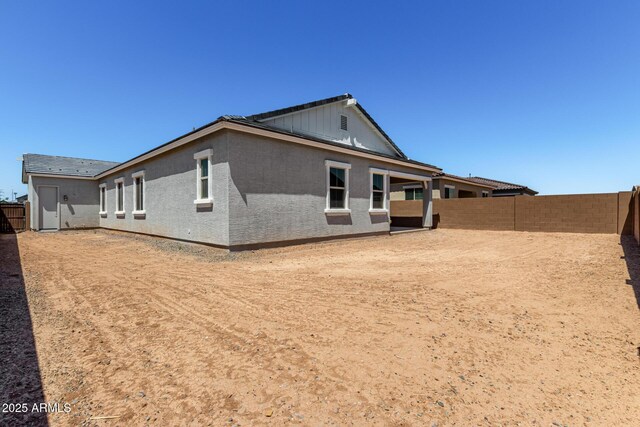 12029 W Marguerite Ave, Avondale, AZ 85323 - rear view of house with a fenced backyard and stucco siding