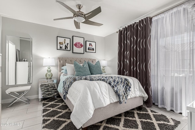 7575 E Indian Bend Rd Unit 1142, Scottsdale, AZ 85250 - bedroom with baseboards, ceiling fan, and light wood-type flooring