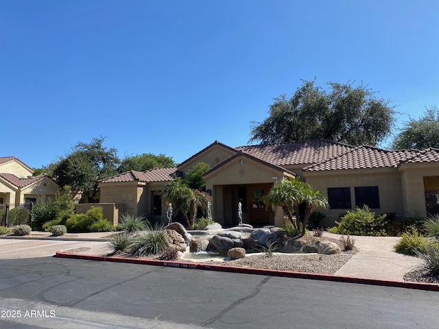 7575 E Indian Bend Rd Unit 1142, Scottsdale, AZ 85250 - mediterranean / spanish home with stucco siding and a tile roof