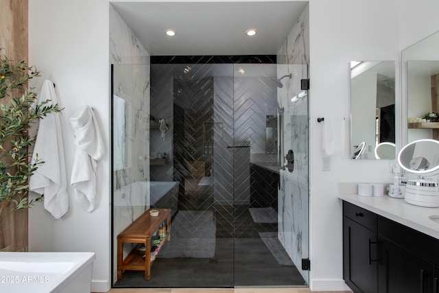 full bath featuring vanity, recessed lighting, and a stall shower