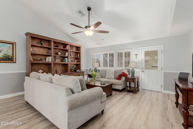 living room with vaulted ceiling, ceiling fan, and light hardwood / wood-style flooring