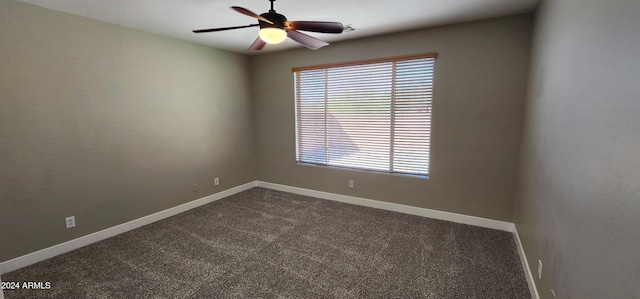 carpeted empty room featuring ceiling fan