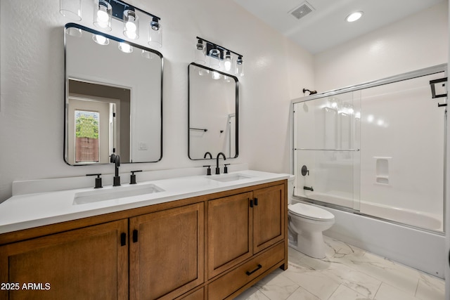 bathroom featuring double vanity, visible vents, marble finish floor, and a sink