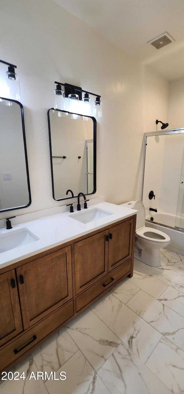 full bathroom featuring vanity, toilet, and shower / bath combination