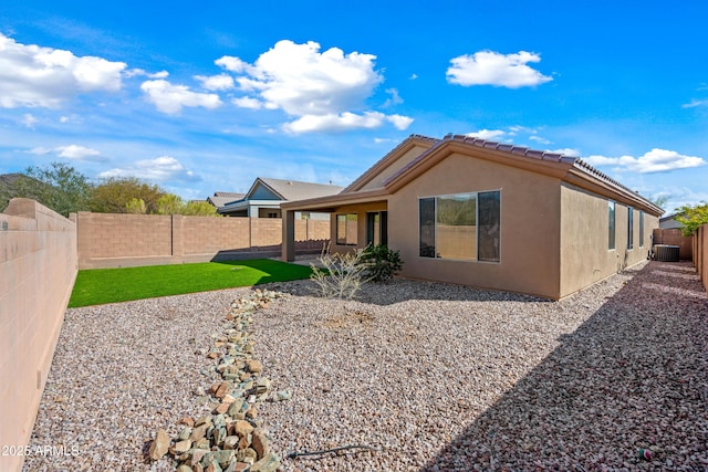 back of property featuring a patio, a fenced backyard, stucco siding, and central air condition unit