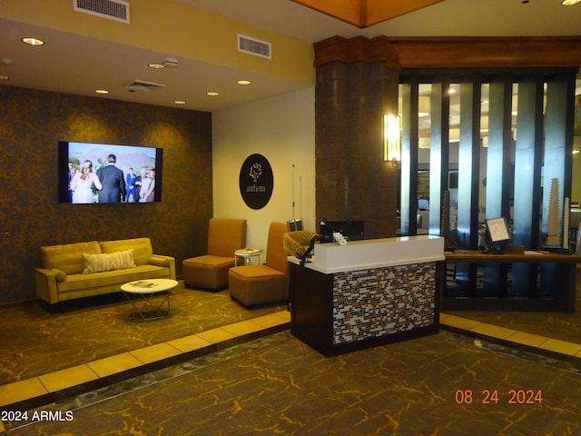 reception area featuring ornate columns