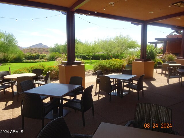 view of patio / terrace featuring a mountain view