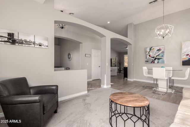 interior space featuring vaulted ceiling and an inviting chandelier