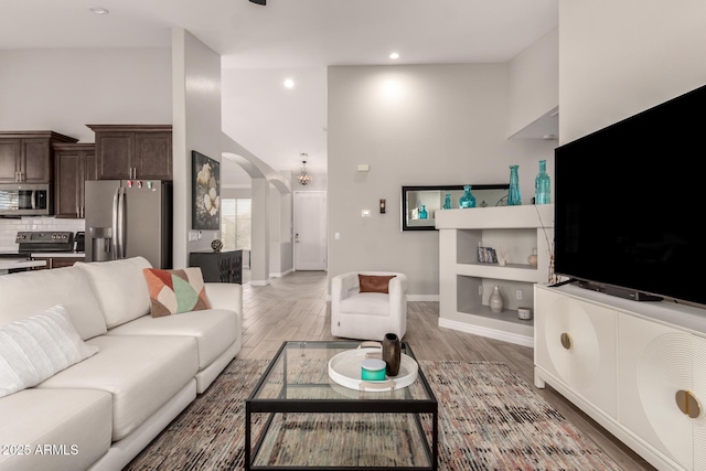 living room with light hardwood / wood-style flooring