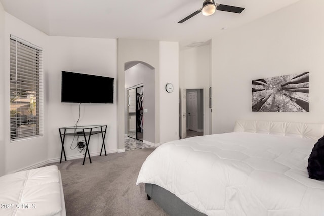 bedroom featuring ceiling fan, carpet, and a closet