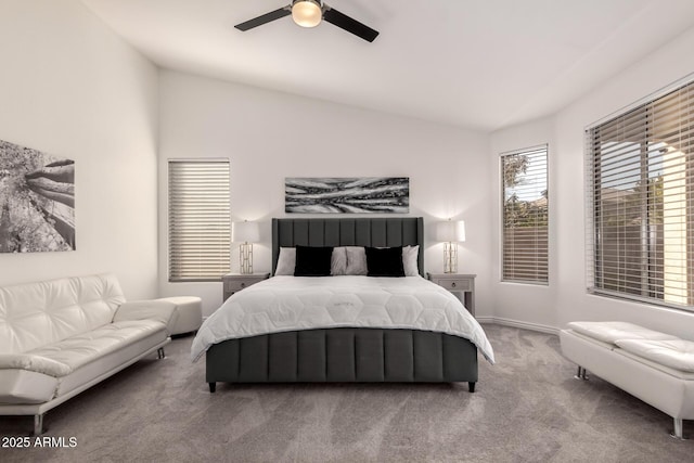 carpeted bedroom with lofted ceiling and ceiling fan