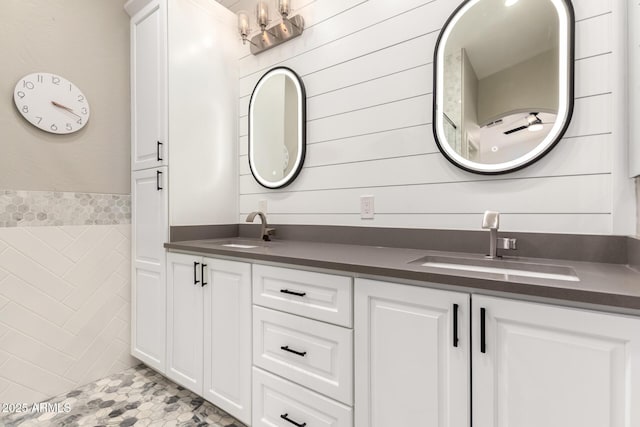 bathroom with tile walls and vanity