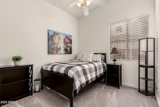 bedroom featuring ceiling fan, light colored carpet, and lofted ceiling