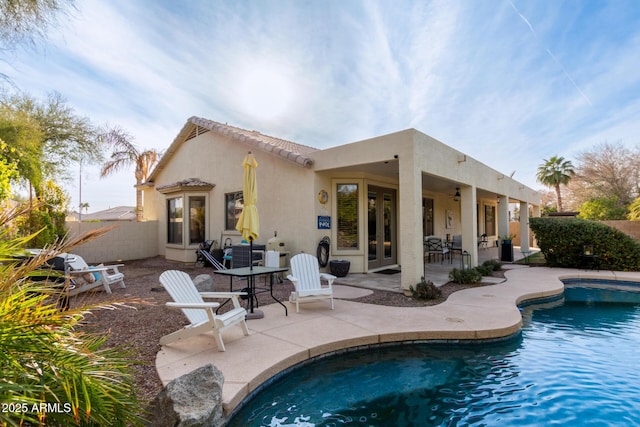 back of property featuring a patio area