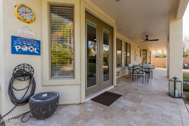 view of patio featuring ceiling fan and french doors