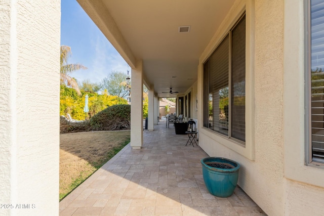 view of patio / terrace featuring ceiling fan