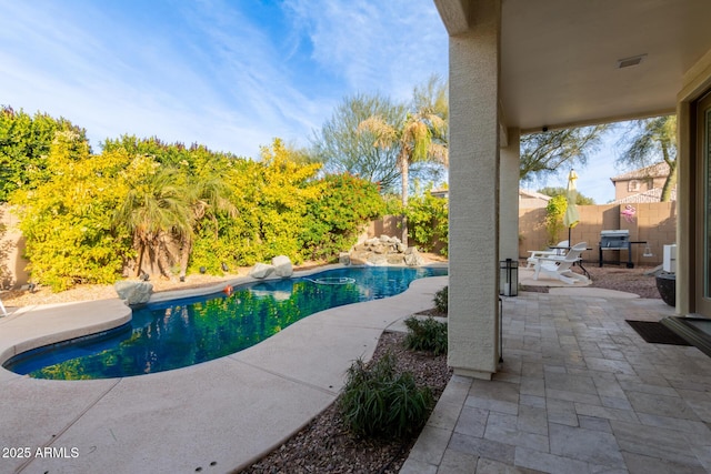 view of swimming pool featuring a patio